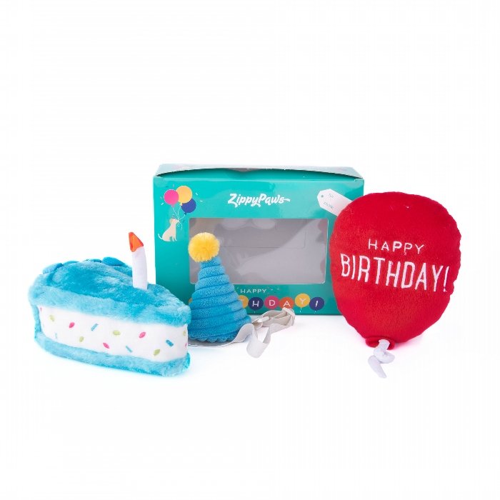 Zippy Paws 3-piece Birthday Box set in blue for dogs and puppies, including a Birthday Cake plush, balloon plush, and birthday hat