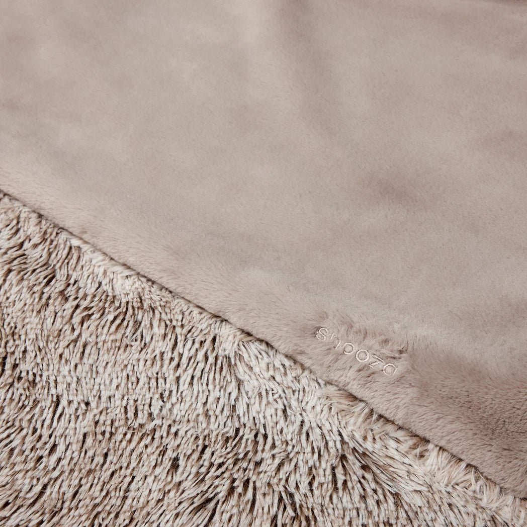 Close-up view of the Snooza Calming Cuddler Blanket in Mink, emphasizing the plush, soft texture and intricate details of the long-pile fabric.