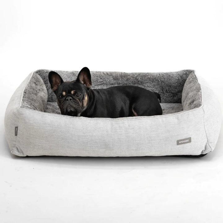 Comfortable Bolstered Sides of Snooza Ortho Snuggler with dog in snoza bed