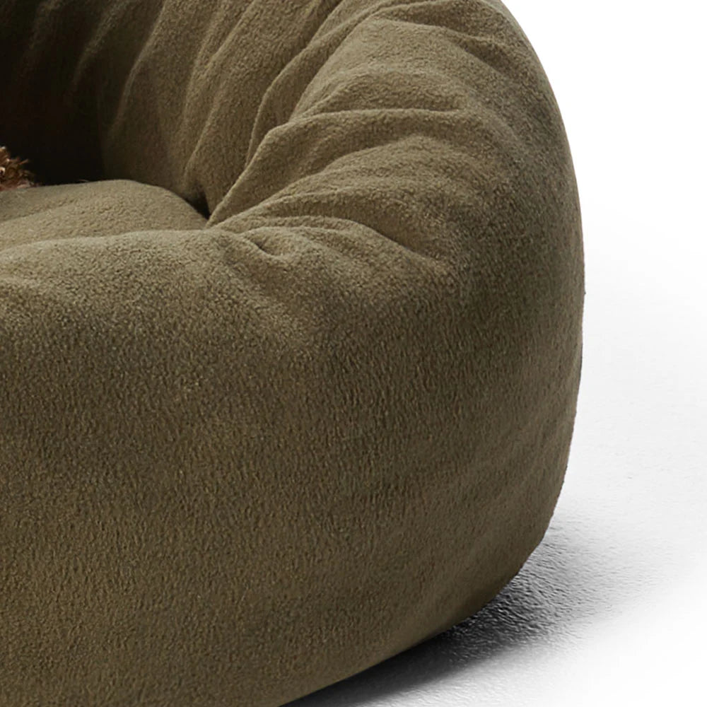 Close-up view of the soft polar fleece fabric of the Snooza Self-Warming Cuddler in Olive.