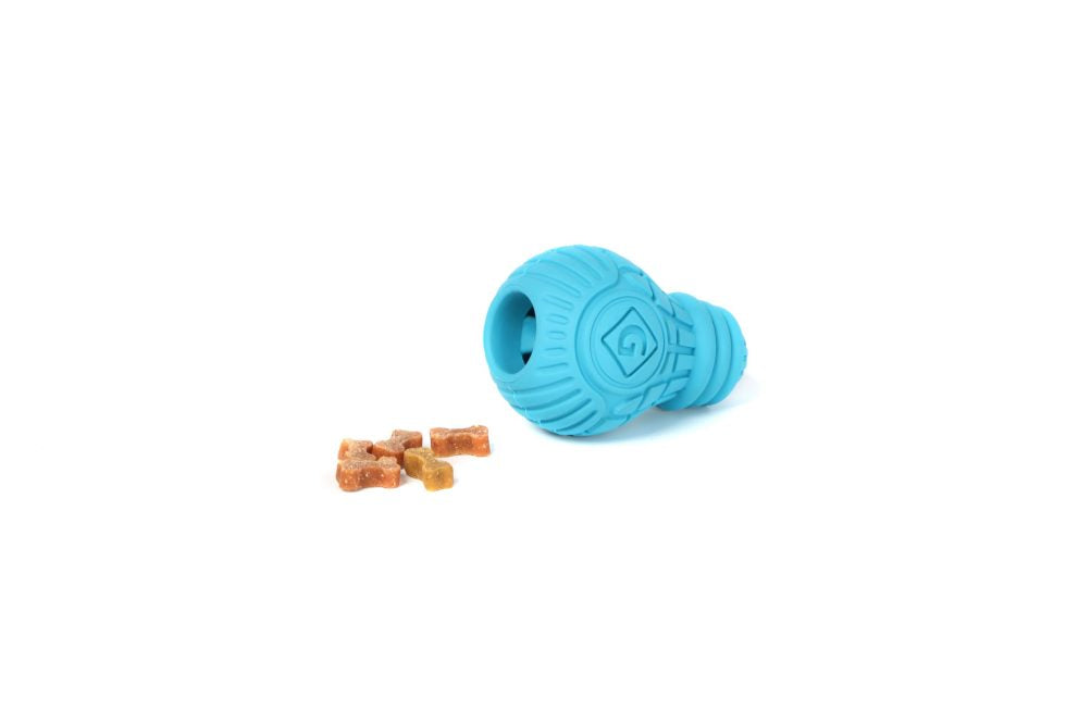 Small, blue GiGwi Treat Dispensing Bulb on its side with treats, showcasing its treat dispensing capability on a white background.