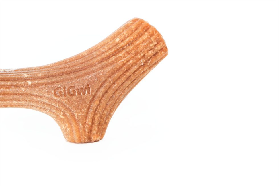 Close-up of GiGwi Wooden Antler dog chew toy, featuring the brand logo and textured surface for dental health and entertainment.