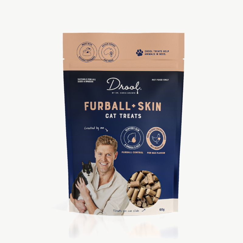 Packaging of Drool by Dr. Chris Brown Furball and Skin Treats, featuring a playful design with illustrations of cats and a bowl of treats, emphasizing natural ingredients and skin health.