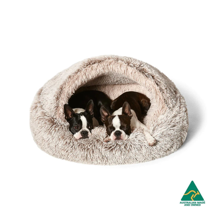 Dogs comfortably snuggled in the Snooza Calming Hoodie Cuddler - Mink