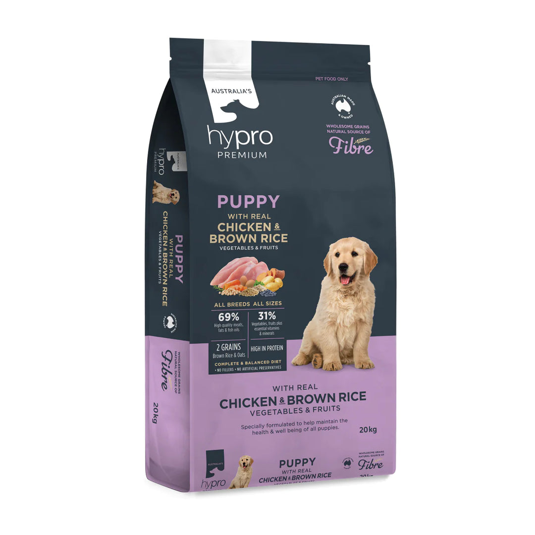 Hypro Premium Puppy Chicken & Brown Rice formula packaging featuring an adorable puppy enjoying a bowl of nutritious meal surrounded by fresh ingredients like chicken, brown rice, peas, carrots, and spinach.