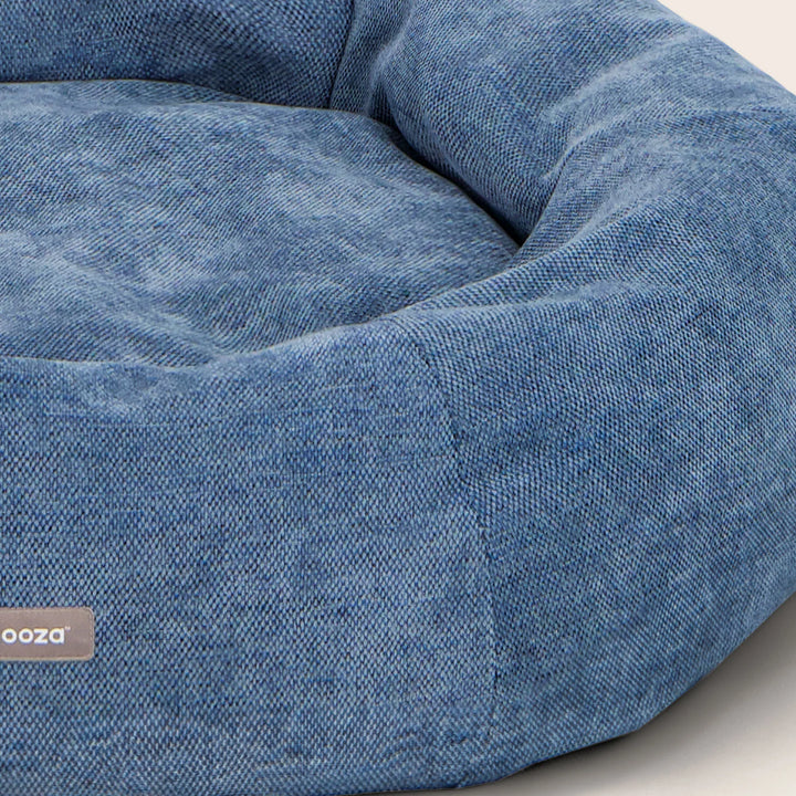 Soft, luxe furnishing fabric in a natural tone, highlighting the premium texture of the Snooza Panelled Cuddler Dog Bed.