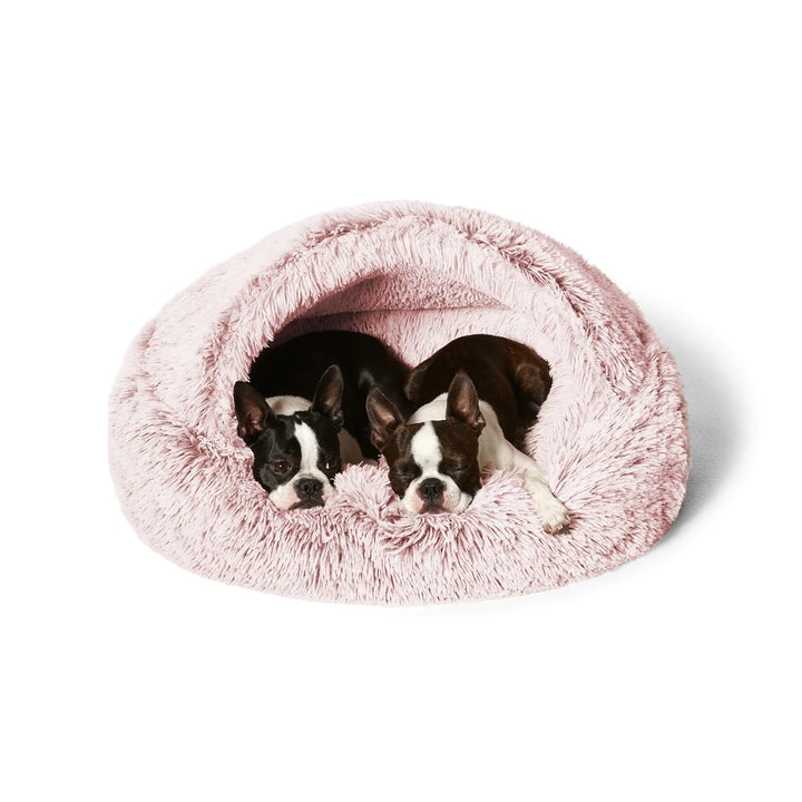 Dogs burrowing in the Snooza Calming Hoodie Cuddler – Bliss, showcasing the cozy cave-style pocket