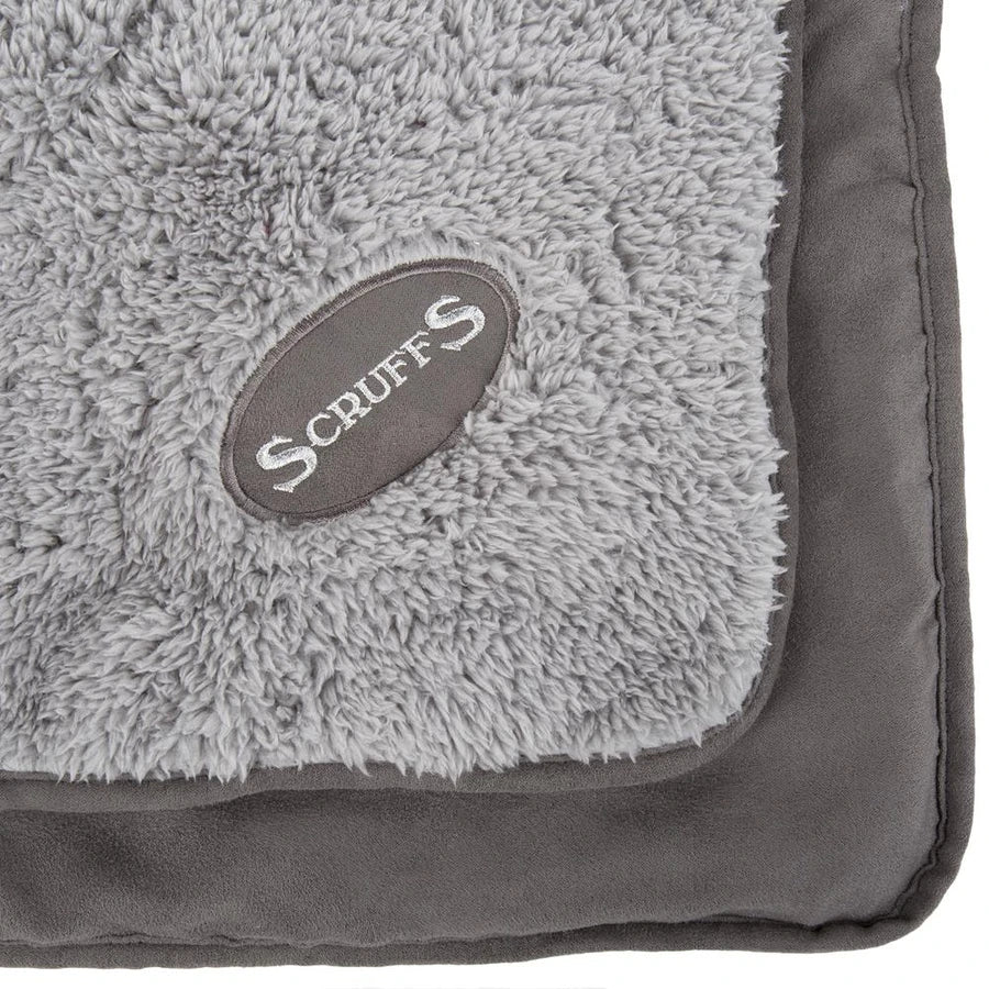 Close-up of the Scruffs brand logo, highlighting the high-quality material and craftsmanship of the blanket.