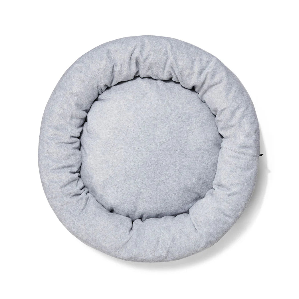 An aerial view of the Snooza Self-Warming Polar Fleece Cuddler bed, showcasing its design and color.