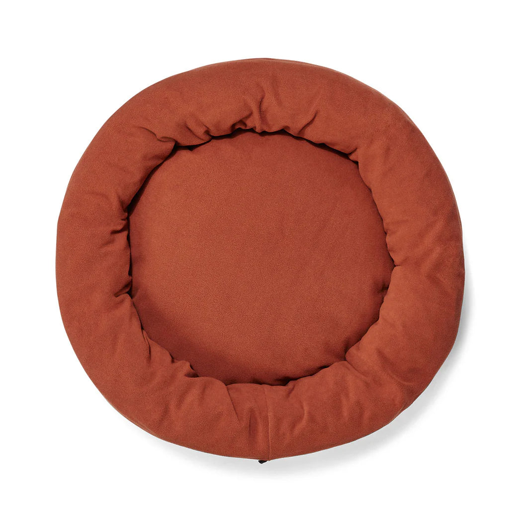 Overhead view of the Snooza Self-Warming Polar Fleece Cuddler in Rust on a white background.