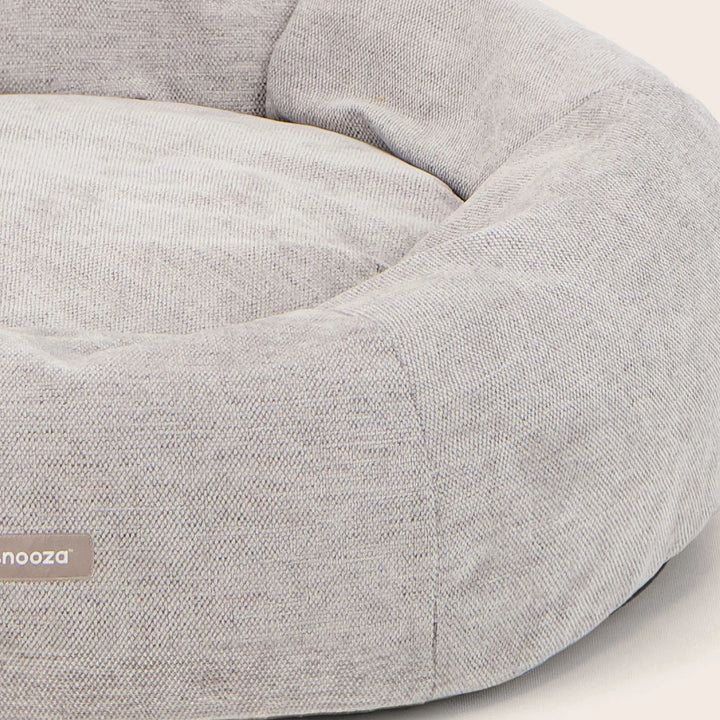 Close-up of the Snooza Panelled cuddler dog bed in Pebble showing  fabric texture – Soft, high-quality furnishing fabric in a modern neutral tone.