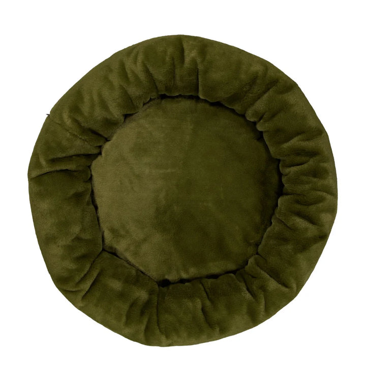  Overhead image of the Leaf Snooza Luxe Fur Cuddler, emphasizing its cozy donut shape and luxurious fur covering.