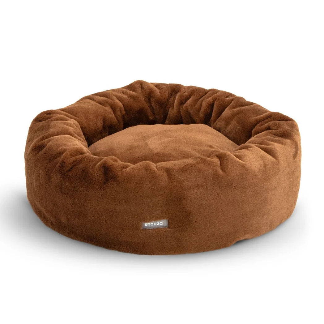 Frontal view of the Nutmeg Snooza Luxe Fur Cuddler, displaying the Snooza logo and the bed's cozy donut-shaped design.