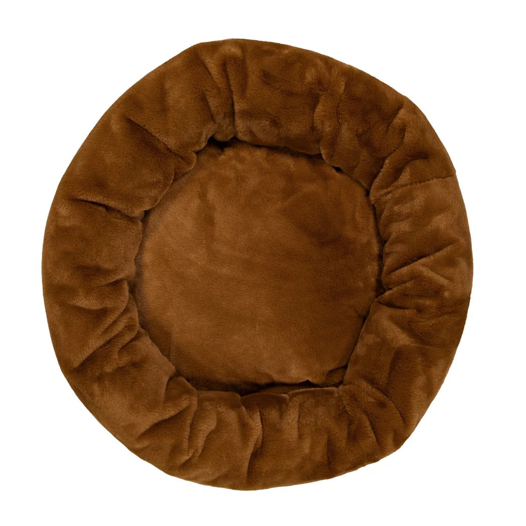 Overhead shot of the Nutmeg Snooza Luxe Fur Cuddler, highlighting its plush donut shape and spacious design.