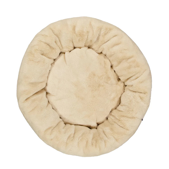 Overhead shot of the Oat Snooza Luxe Fur Cuddler, displaying its plush donut shape and ample space for pets.