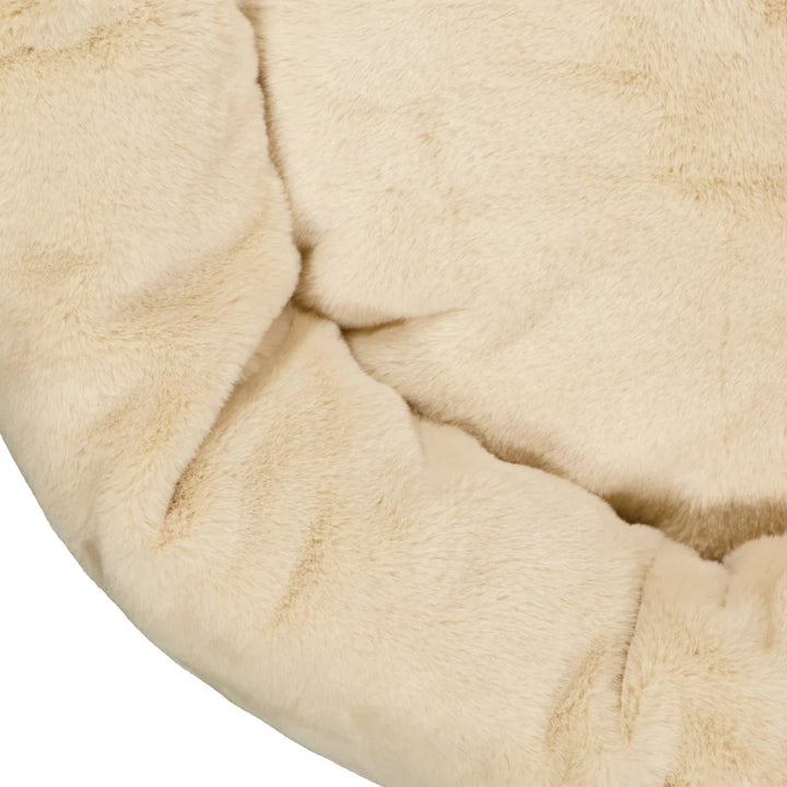  Detailed view of the smooth short pile fur material in the Oat-colored Snooza Luxe Fur Cuddler, highlighting its soft and durable fabric.
