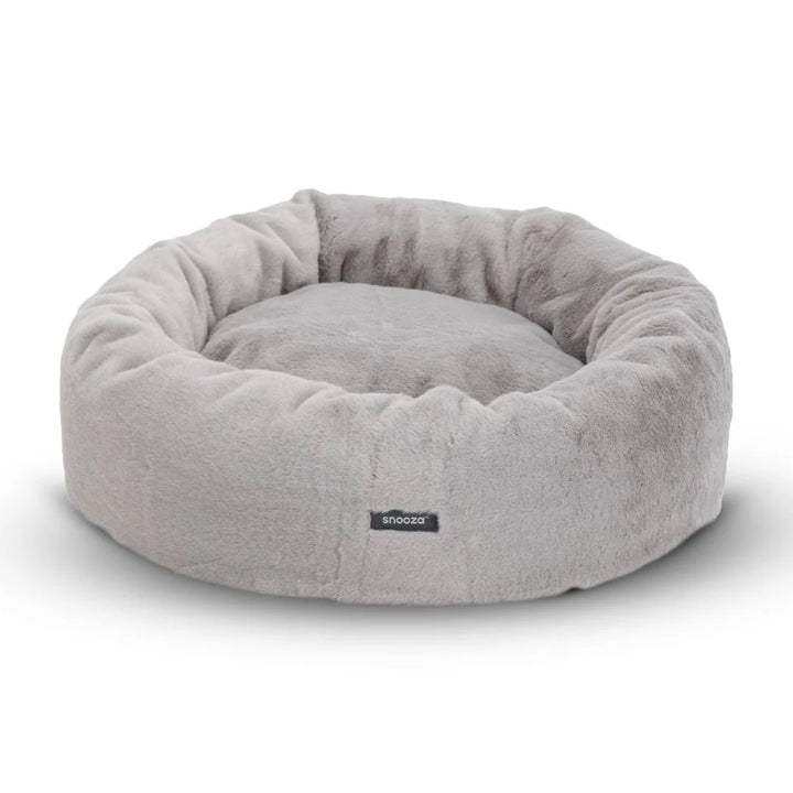 Frontal image of the Twilight Snooza Luxe Fur Cuddler, featuring the Snooza logo and the bed's soft, rounded design.