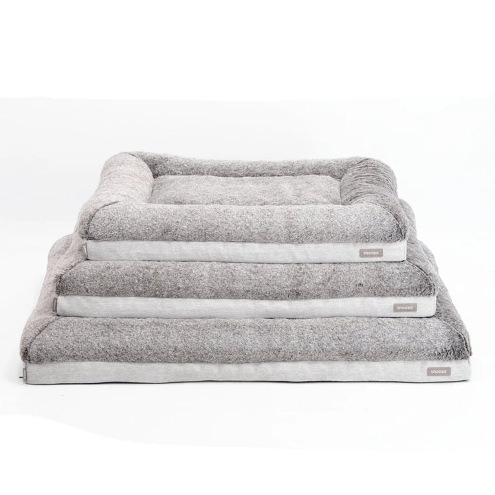 Different sizes of the Snooza Ultra Comfort Lounge Bed - Cashmere stacked together, displaying the variety available for all pet sizes.