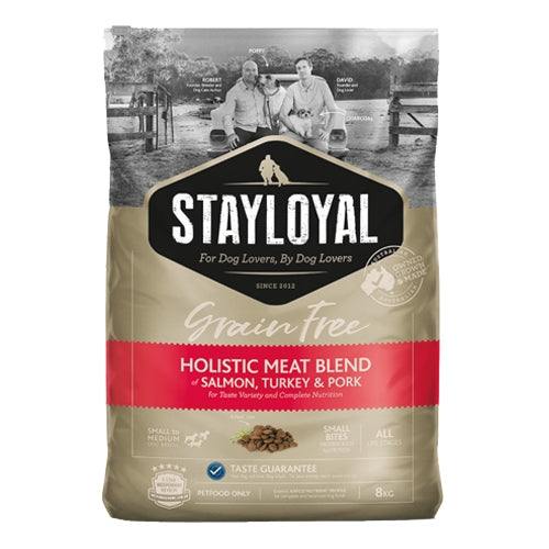 Stay Loyal Holistic Meat Blend - Front View: A bag of premium grain-free dog food with a blend of Salmon, Turkey, and Pork, promoting a healthy and happy dog