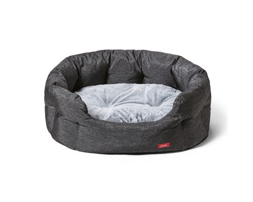 Snooza SUPA Snooza Granite pet bed on a stylish patio, showcasing its high-walled design and plush interior.