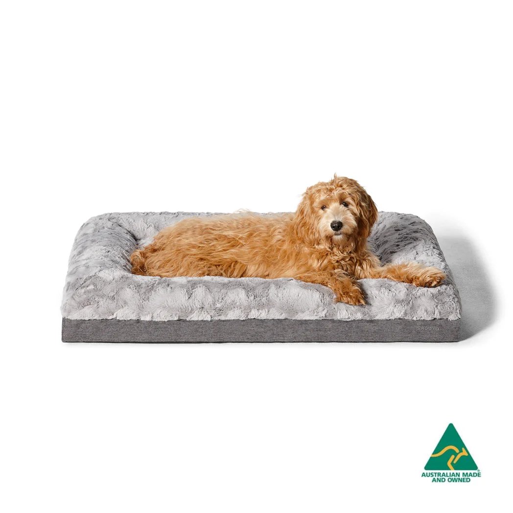 Pet lounging comfortably on the Snooza Ultra Comfort Lounge with low-rise bolster walls