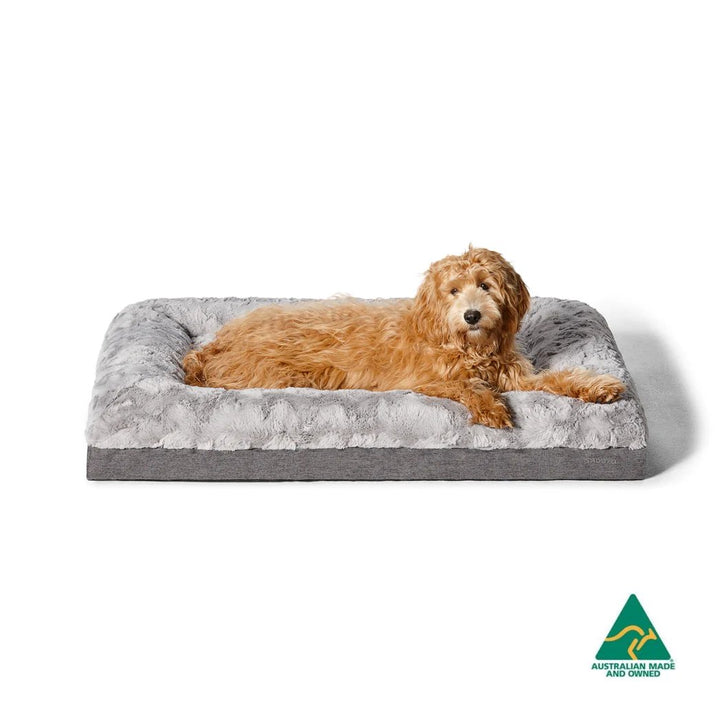 Pet lounging comfortably on the Snooza Ultra Comfort Lounge with low-rise bolster walls