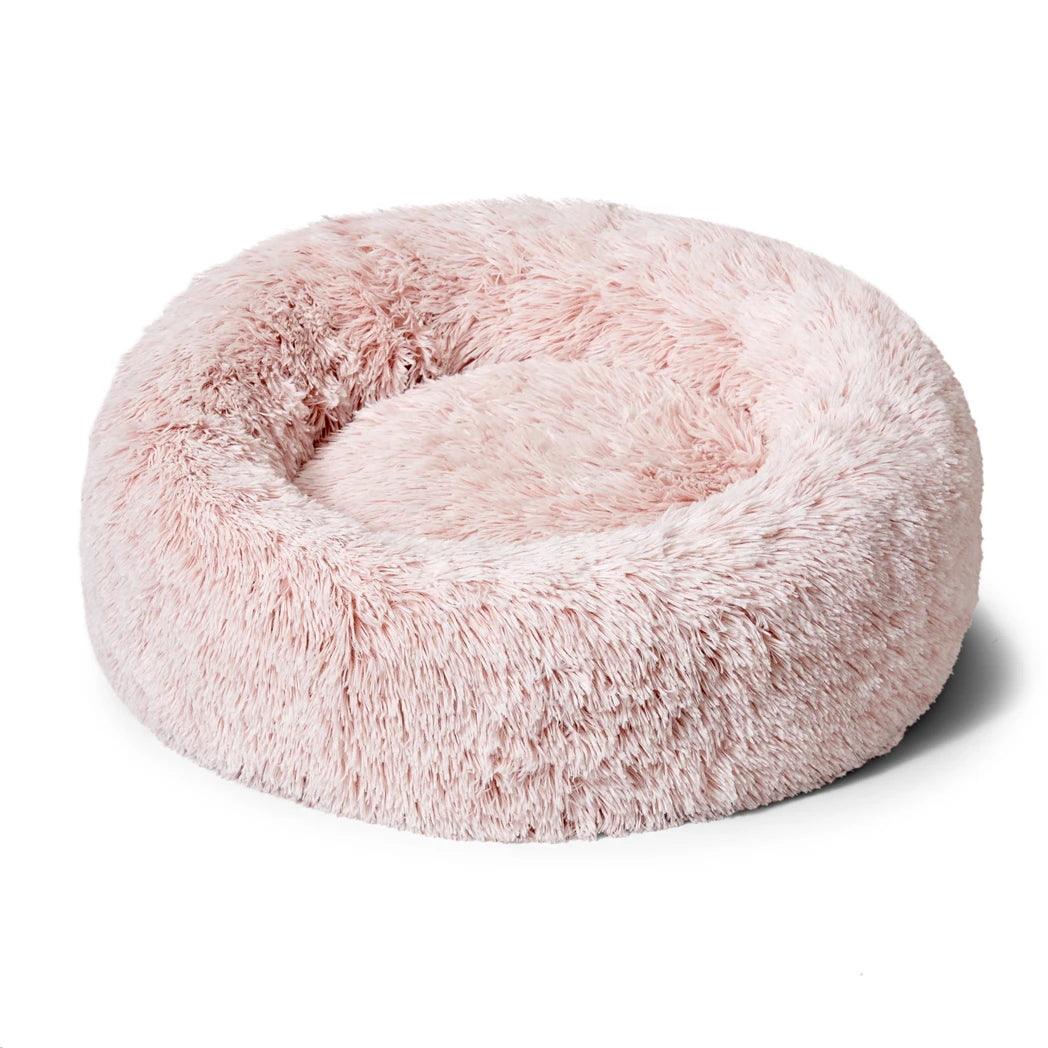 Side view of Snooza Calming Cuddler Bliss Pink donut pet bed.