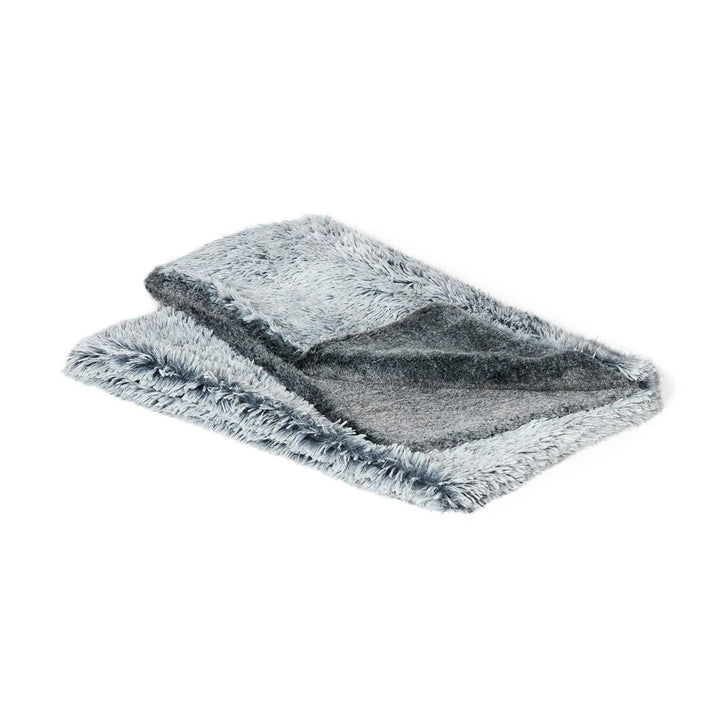 The Snooza Calming Cuddler Blanket neatly folded, clearly showing the double-sided design with Chinchilla on one side and Silver Fox on the other.