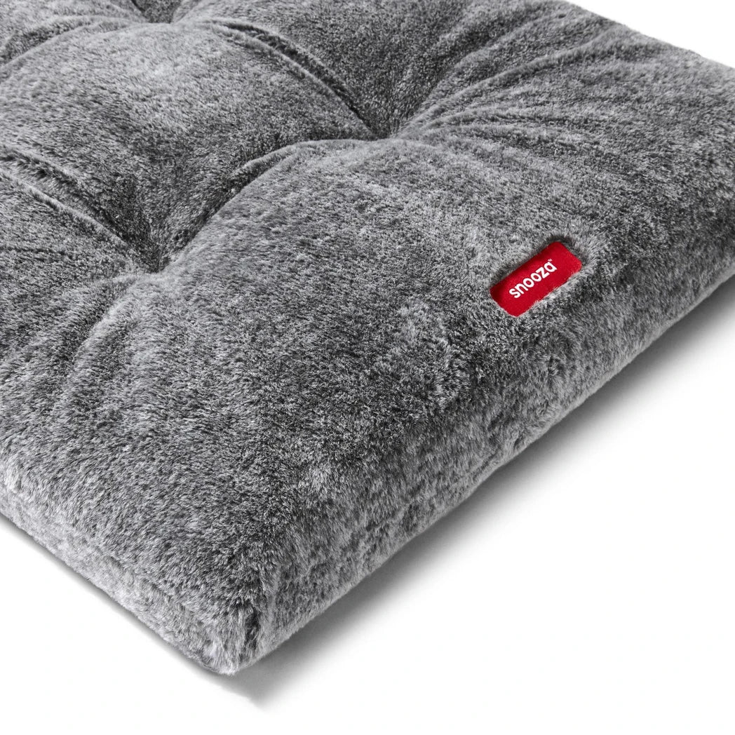 Close-up of the Snooza Plush Calming Multimat in Chinchilla highlighting the bed's texture and brand logo.