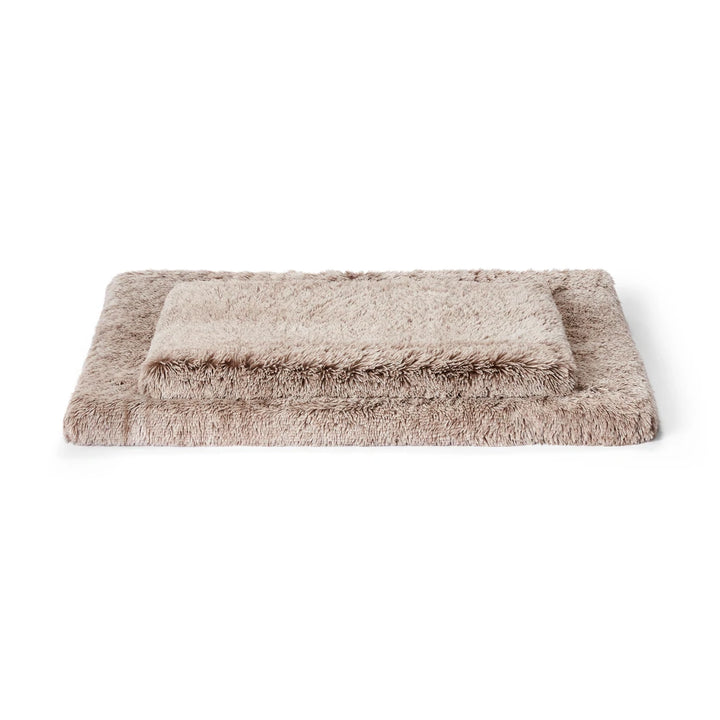 Two different sizes of the Snooza Calming Ortho Bed – Mink for small to large dogs.