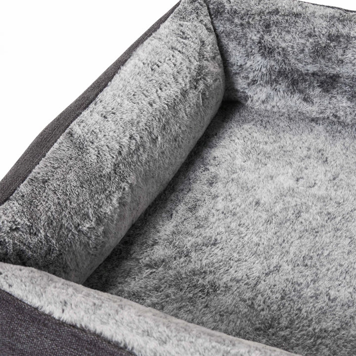 Close-up of the Snooza Ortho Snuggler Dog Bed material and construction showcasing the plush faux fur and two-tone fabric.