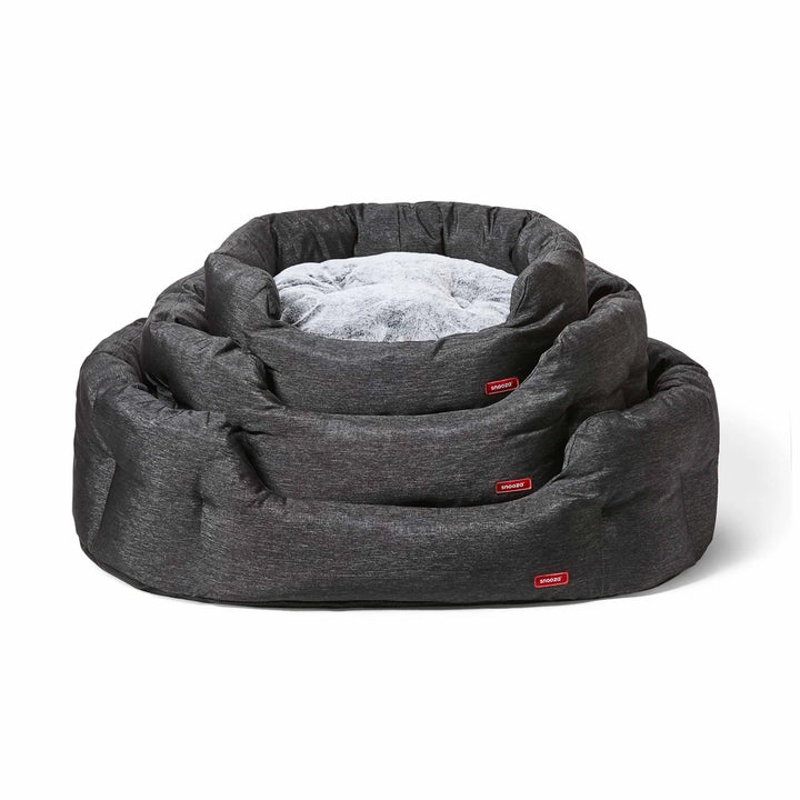 Various sizes of the Snooza SUPA Snooza Granite pet bed stacked on top of each other, showcasing the range of available sizes and high-quality design.