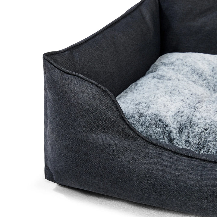 Close-up of the Snooza Travel Bed's reversible cushion with chinchilla faux-fur and water-resistant sides.